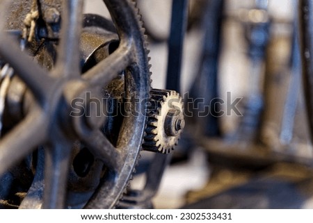 Corroding old cogwheels with shallow depth of field  Royalty-Free Stock Photo #2302533431