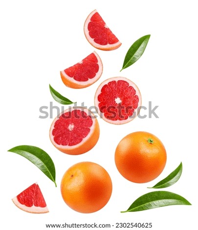 Grapefruit isolated. Grapefruit levitation, fruit slices and green leaves on a white background. Royalty-Free Stock Photo #2302540625