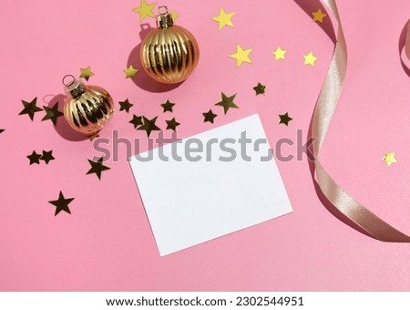 Flat lay party decoration concept on pastel pink background with blank white card. High quality photo