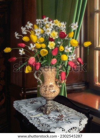 Still life with spring flowers in vase on table