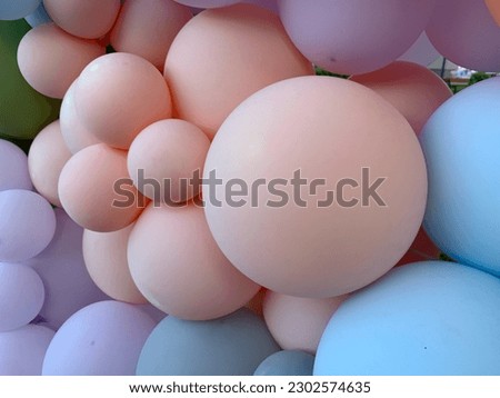 Background texture: Multicolored inflatable balls. Lots of balloons of different sizes. Festive background of gel balloons. Royalty-Free Stock Photo #2302574635