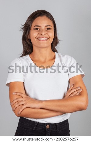 Beautiful Brazilian woman in white shirt, photo shoot. Royalty-Free Stock Photo #2302576257