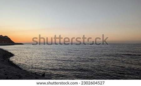 A picture of the sunset and the Mediterranean Sea showing the golden rays of the sun in Tangier, Morocco
