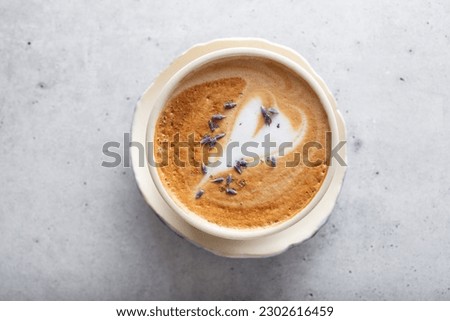 A top down view of a lavender cappuccino.