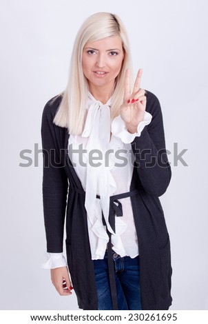 Female peace gesturing with hand, isolated on white 