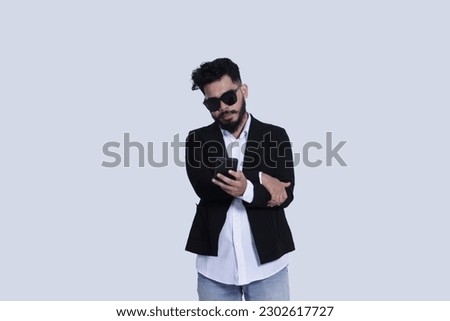 asian male businessman holding smartphone