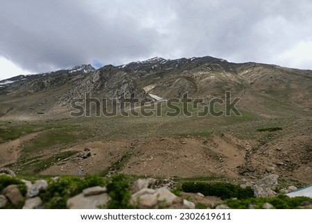 On way to Khunjerab Pass on karakoram Highway (N-35) Silk Road. Babusar top, kaghan, Naran, Gilgit, Hunzawith beautiful view of Hills, mountains, Snow, Tree, Greenery, Lake, River and Stream 
