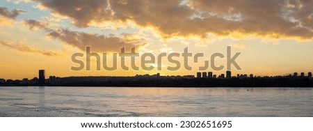 Panoramic view of golden sunset on the Yenisei river in Krasnoyarsk, Russia