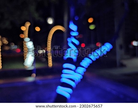Amazing view in the park at the night with blurry and bokeh neon lights outdoor. 