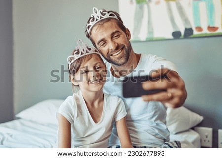 Man, girl child and selfie in princess tiara, happiness with love and care at family home. Smile in picture, father and daughter bonding with crown, happy people spending time together in bedroom