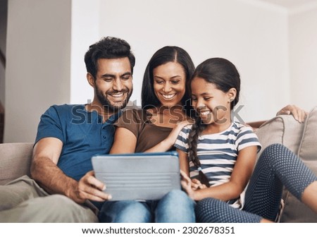 Relax, smile and family on a sofa, tablet and bonding at home, connection and streaming a movie. Parents, mother and father on a couch, games and female child in the living room with cartoon film