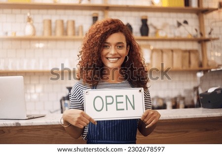 Portrait, woman and smile with open sign in cafe, shop and store for retail trading time, board and advertisement. Happy restaurant owner opening small business with signage, information and welcome