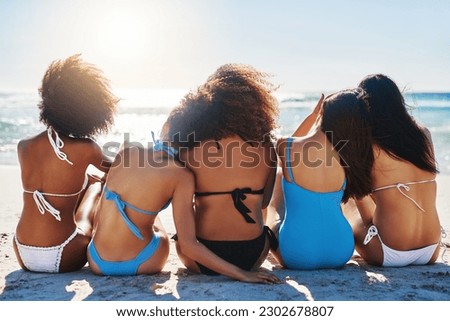 Beach, group and back of girl friends on summer holiday, with real and natural bodies or vacation travel. Paradise, swimwear and women sitting on the sand by an ocean on tropical weekend trip outdoor