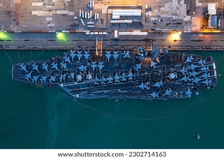 Aerial view of Nuclear ship, Military navy ship carrier full loading jet aircraft. Royalty-Free Stock Photo #2302714163