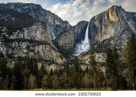 Scenic view of Yosemite Falls with a frozen snow cone, spring snowmelt in the Yosemite National Park, Sierra Nevada mountain range in California, USA Royalty-Free Stock Photo #2302730023