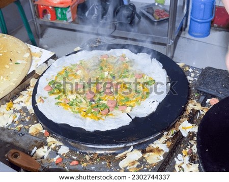 Asian food, Shandong pancake making process Royalty-Free Stock Photo #2302744337