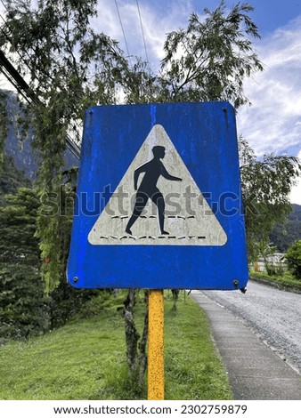 A sign of where we can cross the road