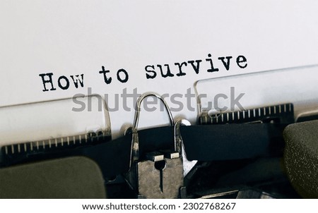 Text How to survive typed on retro typewriter Royalty-Free Stock Photo #2302768267