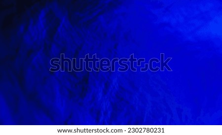 Dark blue crumpled background or grunge wall with wrinkles.  For backdrop, backdrop, macro, image, banner, advertisement, template, poster, aging, rough, damaged, structure, motion, blurry, abstract