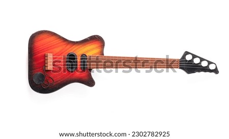 Electric toy guitar isolated on white background. High quality photo