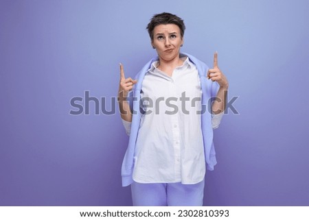 portrait of an informal young brunette woman with a short haircut in a white shirt Royalty-Free Stock Photo #2302810393