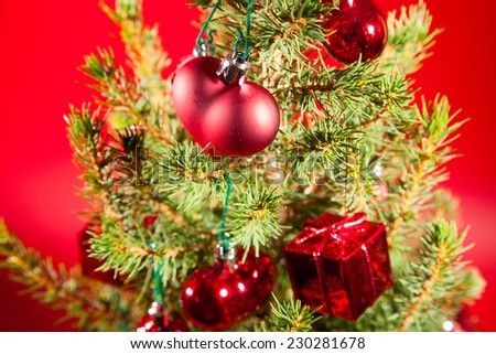 Christmas and New Year decoration with shiny glare on a red background