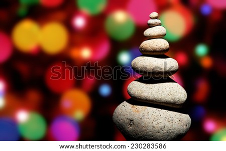 Christmast rock tree with color lights in background