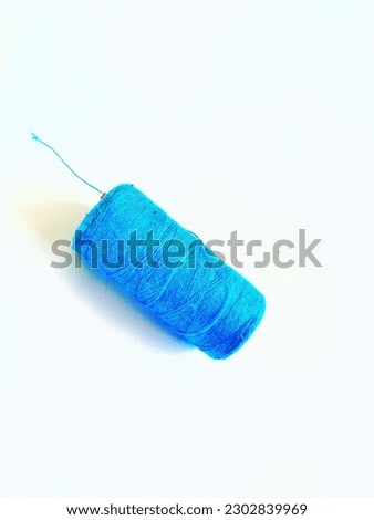 blue thread roll on the white background