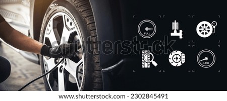 Auto mechanic checking air pressure and inflating car tires with service icons. Concept of car care servicing and maintenance or fix the car leaky or flat tire. Royalty-Free Stock Photo #2302845491