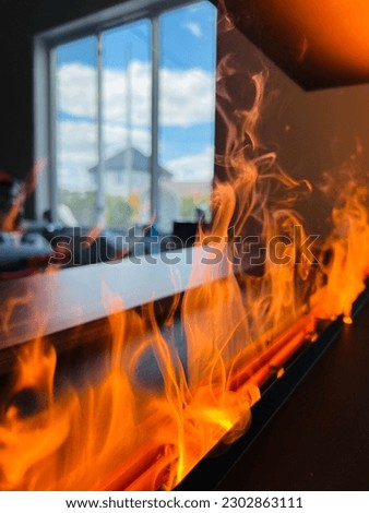 Indoor Water fireplaces. Electronics produces water vapor whose molecules are reflected by light from concealed LED bulbs, creating a realistic effect of flames and smoke