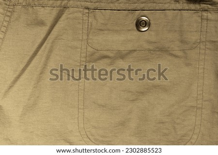 Pocket in light, light-coloured cotton fabric on men's pants