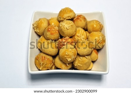 Kue kering nastar nenas or Pineapple flavor pineapple cookies on a wooden board