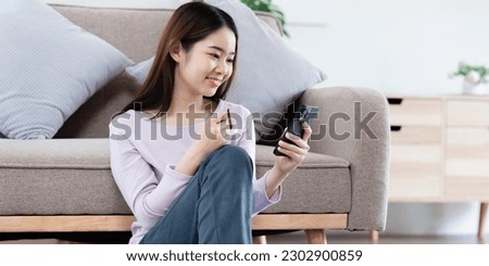 Online store icon, shopping on internet, Asian woman using on virtual screen with hands choosing on smartphone application