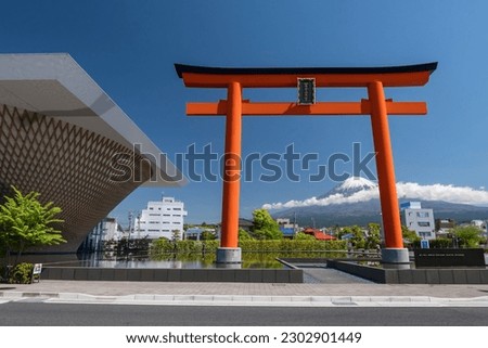 Red Torii gate, Fuji world heritage center building, and mount Fuji with blue sky at Fujnomiya, Shizuoka, Japan. Famous travel destination. Royalty-Free Stock Photo #2302901449