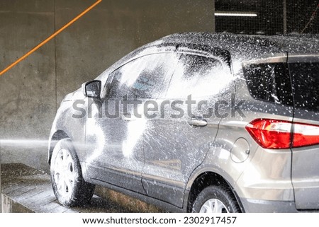 Cars are getting car wash service in the service station
