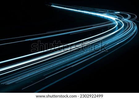 blue car lights at night. long exposure Royalty-Free Stock Photo #2302922499