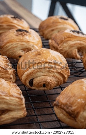 various kinds of croissants on the cooling rack