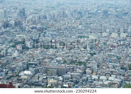 an aerial view of buildings in tokyo as seen from a building observatory