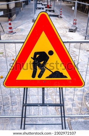 men at work sign in germany - photo