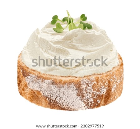 Baguette slice with cream cheese swirl isolated on white background Royalty-Free Stock Photo #2302977519