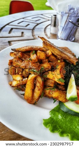 Kenyan Chips Masala or Masala fries Royalty-Free Stock Photo #2302987917