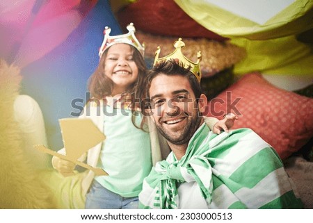 Fantasy dress up, kid portrait and dad together and princess fun in a bedroom fort with crown and girl. Play castle, happiness and smile with father and child in a home excited and happy about a game Royalty-Free Stock Photo #2303000513