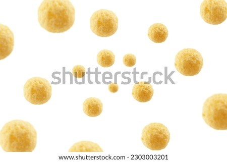 Falling corn ball, isolated on white background, selective focus Royalty-Free Stock Photo #2303003201