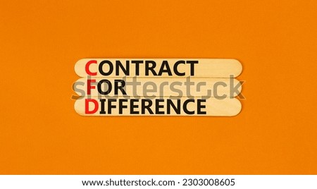CFD symbol. Concept words CFD contract of difference on beautiful wooden sticks. Beautiful orange table orange background. Business and CFD contract of difference concept. Copy space.