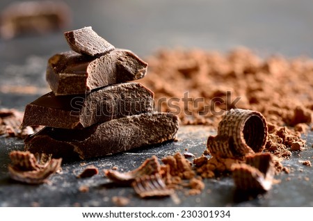 Dark chocolate stack, chips and powder Royalty-Free Stock Photo #230301934