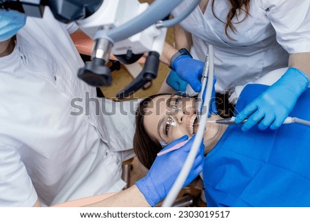 Expert Dental Care for Optimal Oral Health and Beautiful Teeth, Healthy Smiles. Royalty-Free Stock Photo #2303019517