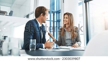Corporate, staff and employees with collaboration, meeting and feedback in an office, happiness and conversation. Partnership, man and woman with startup success, talking and planning with target Royalty-Free Stock Photo #2303039807