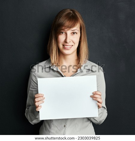 Portrait, poster and mock up with a woman in studio on a dark background holding a blank sign. Announcement, information or advertising with a female brand ambassador showing empty space on a placard