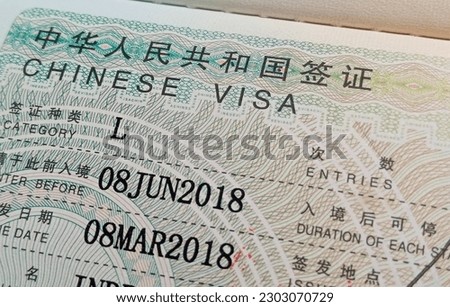 Close Up Chinese visa is approved, applied and added to the passport for traveling  to China
