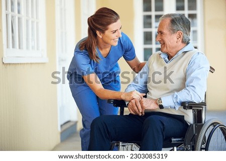 Speaking, happy caregiver or old man in wheelchair in hospital helping an elderly patient for support in clinic. Medical nurse or healthcare social worker talking to a senior person with disability Royalty-Free Stock Photo #2303085319